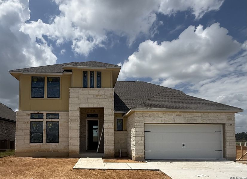 Front exterior of a new home in Buffalo Crossing, Cibolo, TX, highlighting curb appeal (Image 1). Front exterior of a new home in Buffalo Crossing, Cibolo, TX, highlighting curb appeal (Image 1).