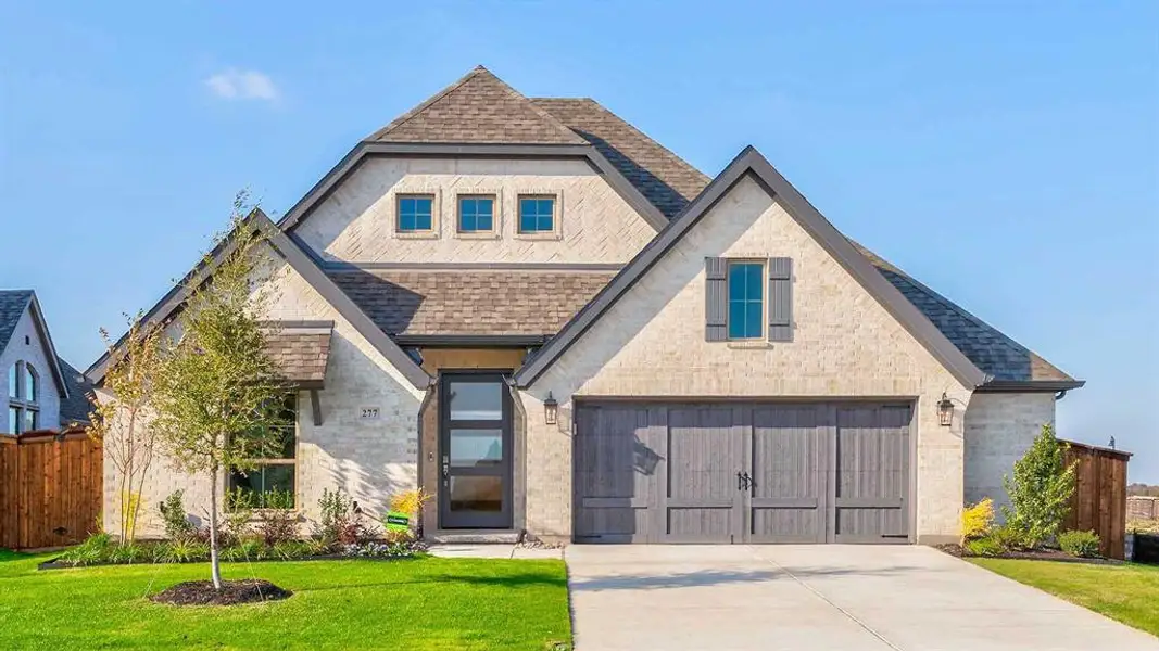 Front exterior of a new home in Myrtle Creek 60', Waxahachie, TX, highlighting curb appeal (Image 1). Front exterior of a new home in Myrtle Creek 60', Waxahachie, TX, highlighting curb appeal (Image 1).