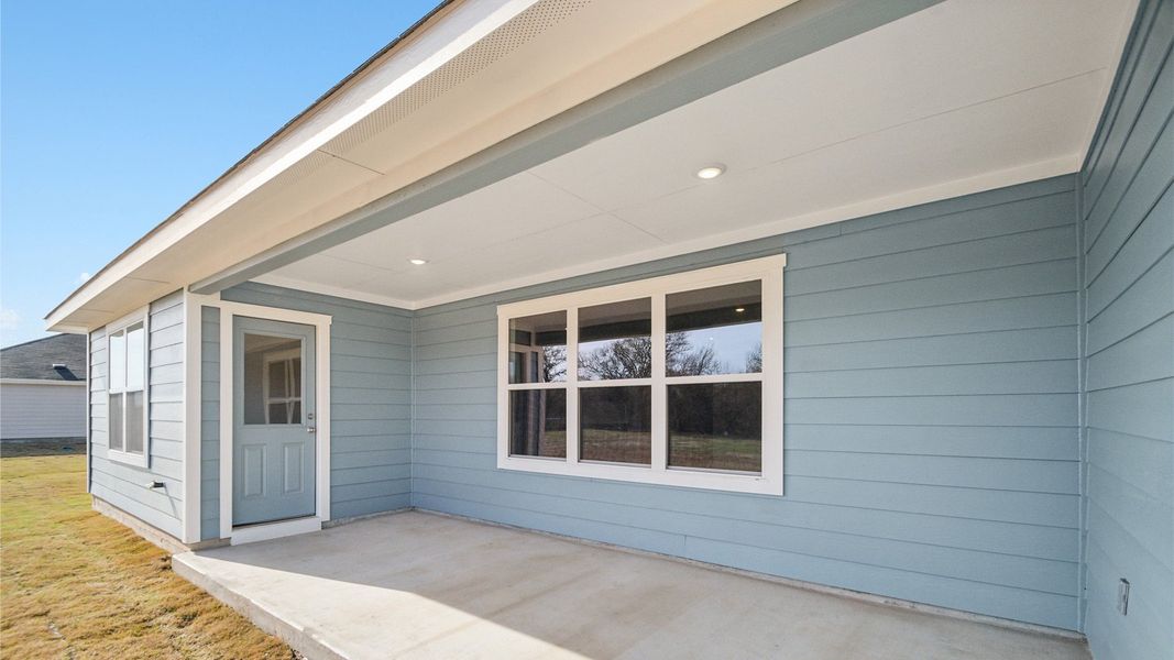 Exterior details and patio area of a home in Railhead, Cedar Creek (Image 17).