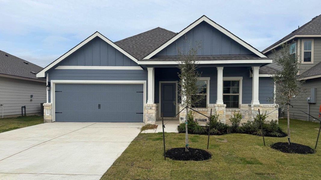 Front exterior of a new home in Southern Pointe, College Station, TX, highlighting curb appeal (Image 1).