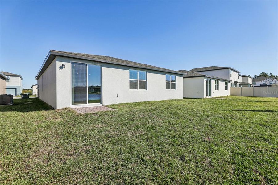 Exterior details and patio area of a home in Lake Deer Estates - Signature Series, Poinciana (Image 22).