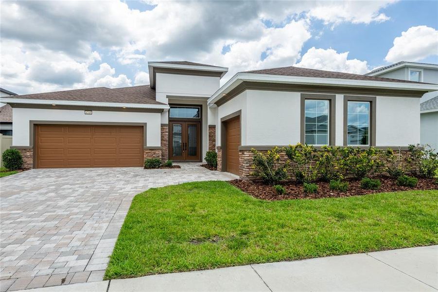 Front exterior of a new home in , Wesley Chapel, FL, highlighting curb appeal (Image 25).