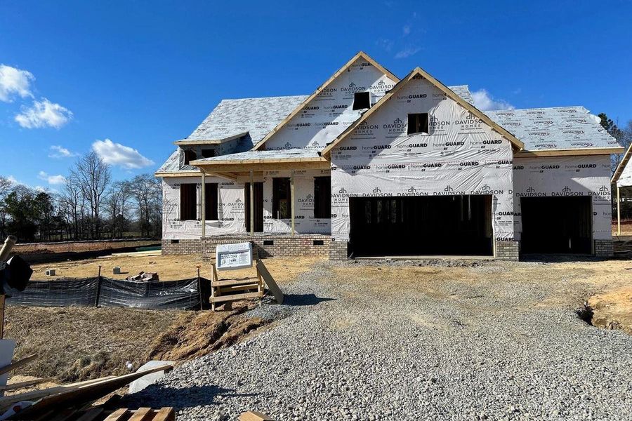 Front exterior of a new home in Tobacco Road, Angier, NC, highlighting curb appeal (Image 3).