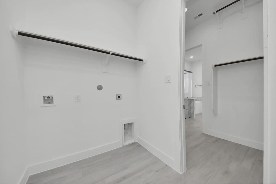 Representative unfurnished interior of a home built from the Summerton by Chesmar Homes in Meridiana 50's and 60's, Manvel (Image 58).