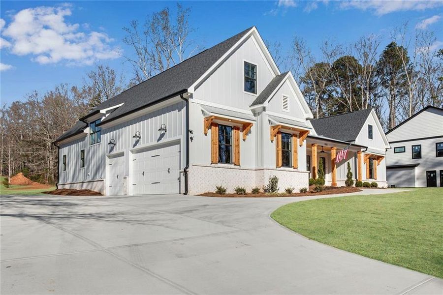 Front exterior of a new home in , Hiram, GA, highlighting curb appeal (Image 28).