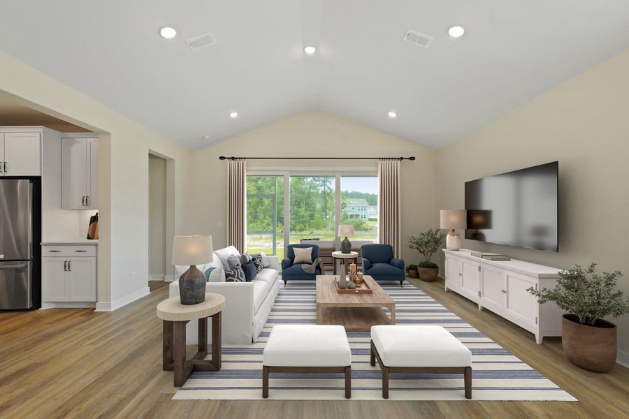 Great room featuring vaulted ceiling