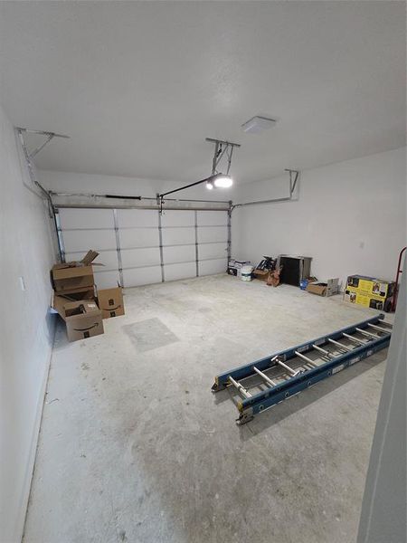 Garage featuring a garage door opener