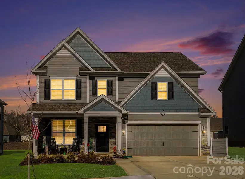 Front exterior of a new home in Falls Cove, Troutman, NC, highlighting curb appeal (Image 1). Front exterior of a new home in Falls Cove, Troutman, NC, highlighting curb appeal (Image 1).