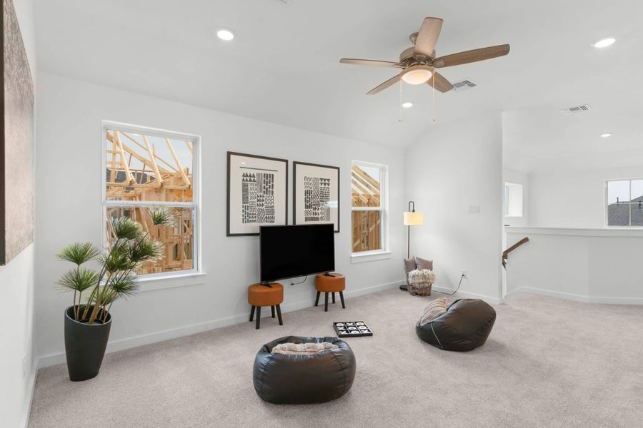Representative furnished interior of a home built from the Phillip by Chesmar Homes in Deerbrooke Cottages, Leander (Image 7).