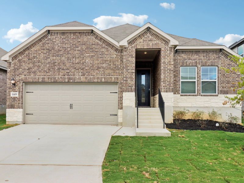 Front exterior of a new home in Sagebrooke - Classic Series, San Antonio, TX, highlighting curb appeal (Image 1). Front exterior of a new home in Sagebrooke - Classic Series, San Antonio, TX, highlighting curb appeal (Image 1).