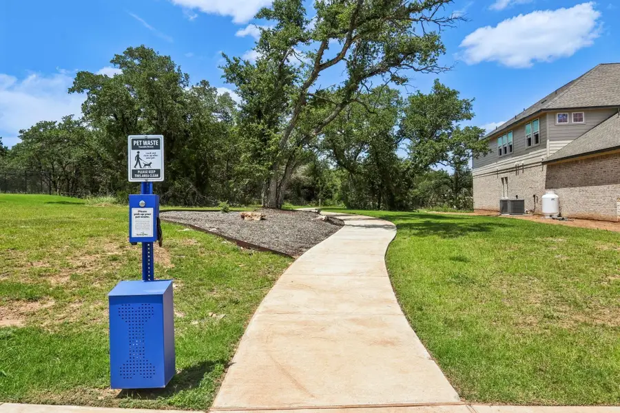 Front exterior of a new home in Heights at San Gabriel, Georgetown, TX, highlighting curb appeal (Image 2).
