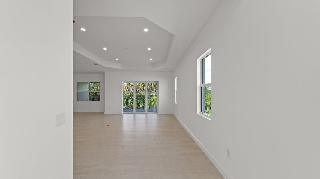Spacious, unfurnished interior of a new home in Verandah Real Estate and Homes for Sale in Fort Myers, FL - Neal Communities, Fort Myers (Image 13).