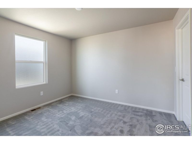 Spacious, unfurnished interior of a new home in Trailside Alley Load - Single Family Homes, Timnath (Image 21).