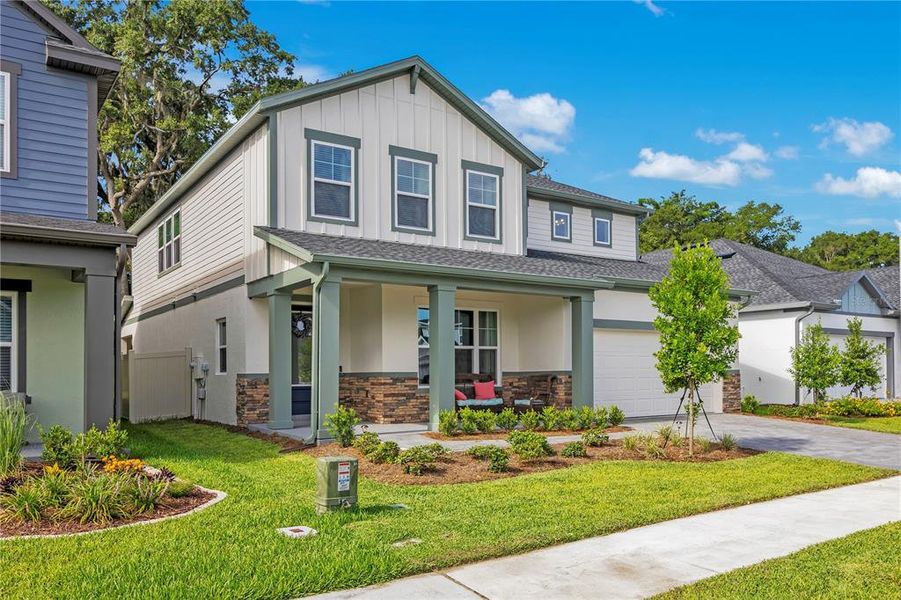 Front exterior of a new home in Oakfield at Mount Dora Village Series, Mount Dora, FL, highlighting curb appeal (Image 22).