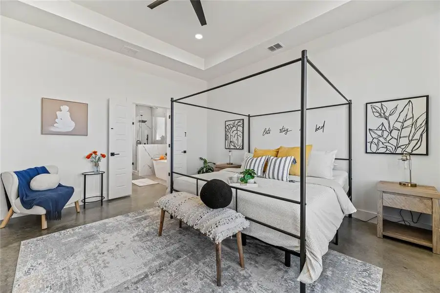 Bedroom featuring concrete flooring, connected bathroom, recessed lighting, and a ceiling fan Bedroom featuring concrete flooring, connected bathroom, recessed lighting, and a ceiling fan