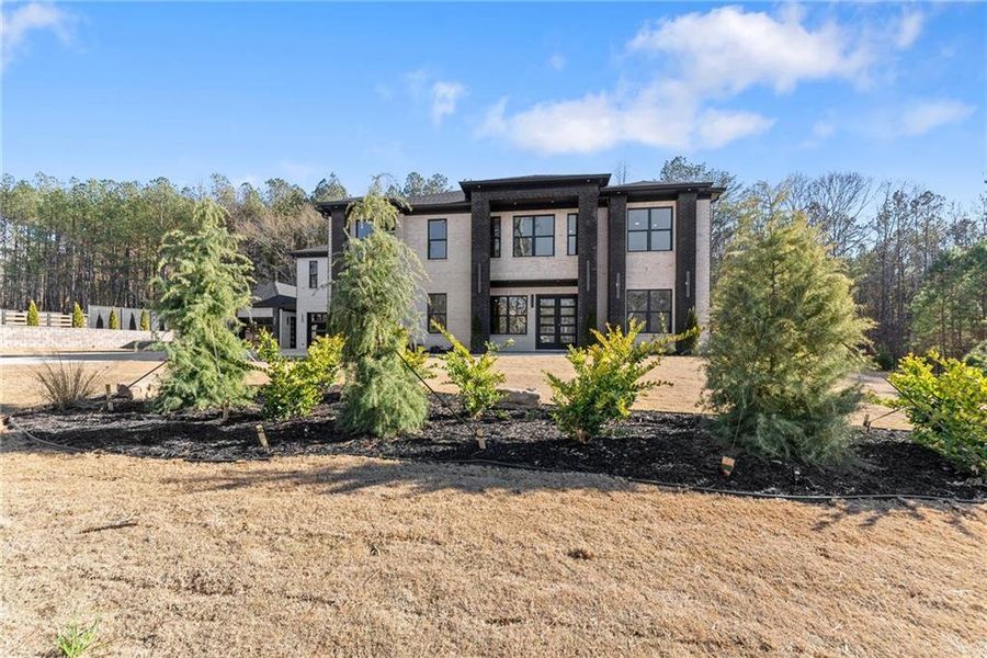 Front exterior of a new home in , Hoschton, GA, highlighting curb appeal (Image 34).