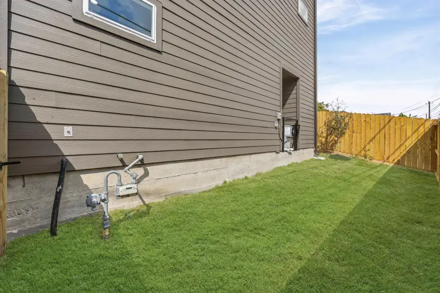 Exterior details and patio area of a home in , Houston (Image 4). Exterior details and patio area of a home in , Houston (Image 4).