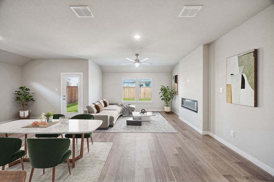 Living and Dining Room in the Heisman home plan by Trophy Signature Homes – REPRESENTATIVE PHOTO