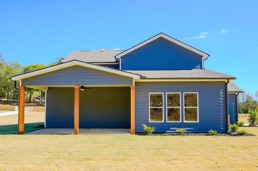 Front exterior of a new home in Pinegate, Covington, GA, highlighting curb appeal (Image 2).