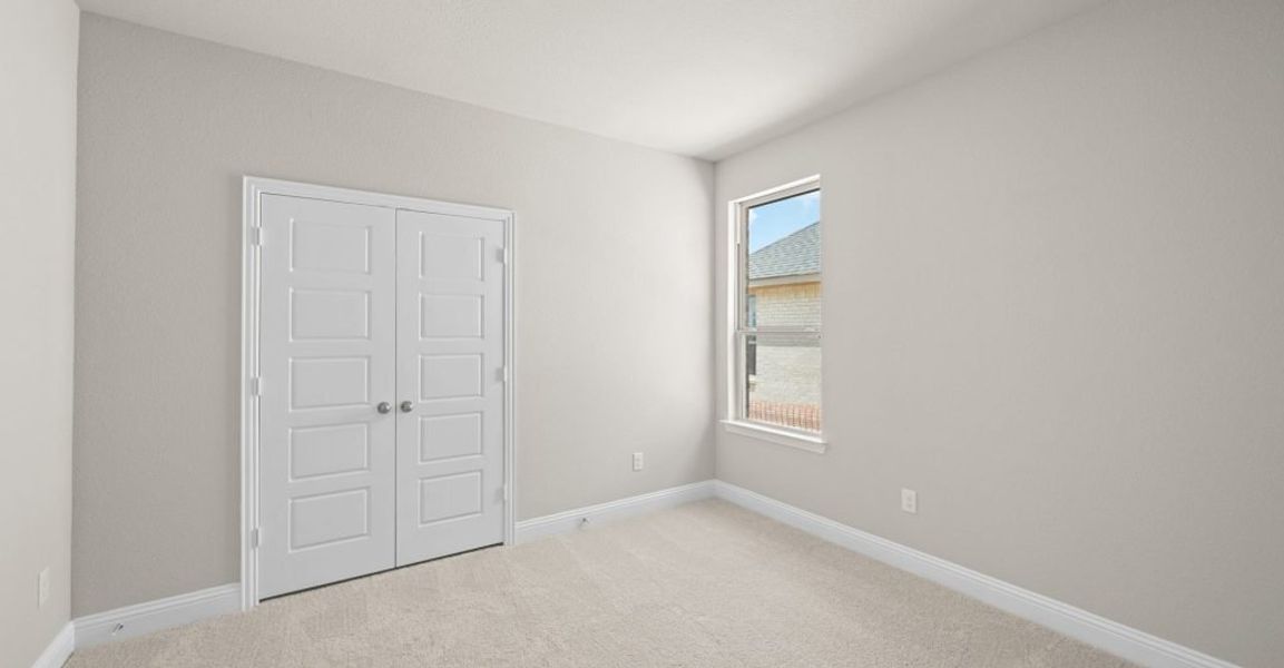 Representative exterior photo of a completed home built from the Donnington by Impression Homes in Still Water Lake, Godley, TX (Image 22).