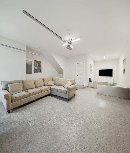 Interior shot of the three car garage! endless possibilities for a workout room, car gurus, golf simulator, and more! Interior shot of the three car garage! endless possibilities for a workout room, car gurus, golf simulator, and more!