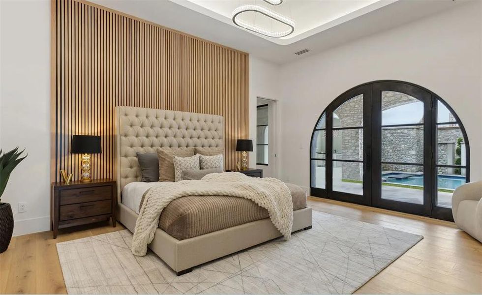 Bedroom featuring access to outside and wood finished floors