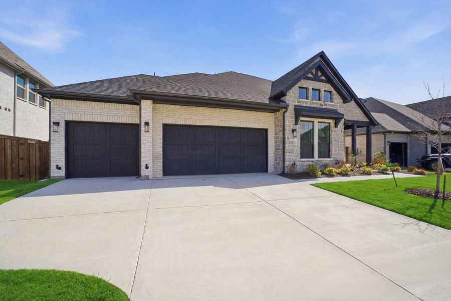 Front exterior of a new home in Sonoma Verde, Rockwall, TX, highlighting curb appeal (Image 2).