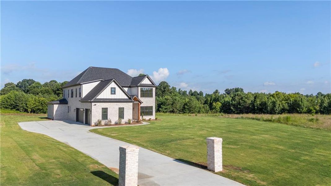 Front exterior of a new home in , Jefferson, GA, highlighting curb appeal (Image 26).