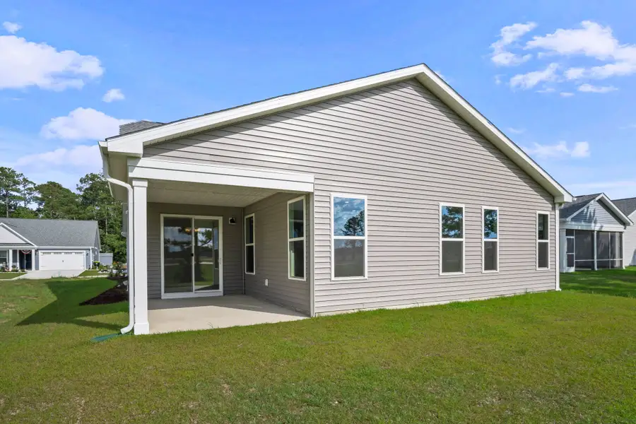 Exterior details and patio area of a home in Coastal Club of the Carolinas, Calabash (Image 3).