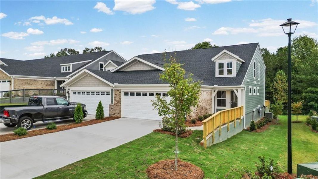 Front exterior of a new home in Villas at Gold Creek, Dawsonville, GA, highlighting curb appeal (Image 22).