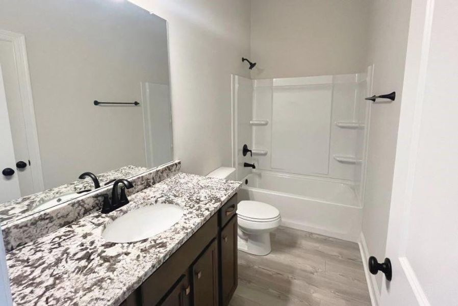 Furnished interior view inside a new home in Orange Gardens, Orange (Image 5).