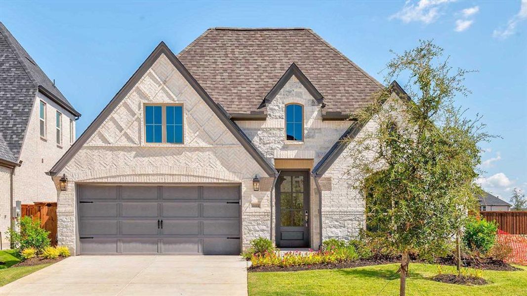 Front exterior of a new home in Mosaic 50', Celina, TX, highlighting curb appeal (Image 1). Front exterior of a new home in Mosaic 50', Celina, TX, highlighting curb appeal (Image 1).