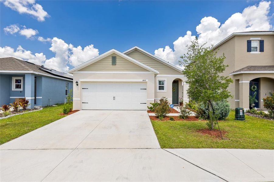 Front exterior of a new home in Cascades, Davenport, FL, highlighting curb appeal (Image 1). Front exterior of a new home in Cascades, Davenport, FL, highlighting curb appeal (Image 1).