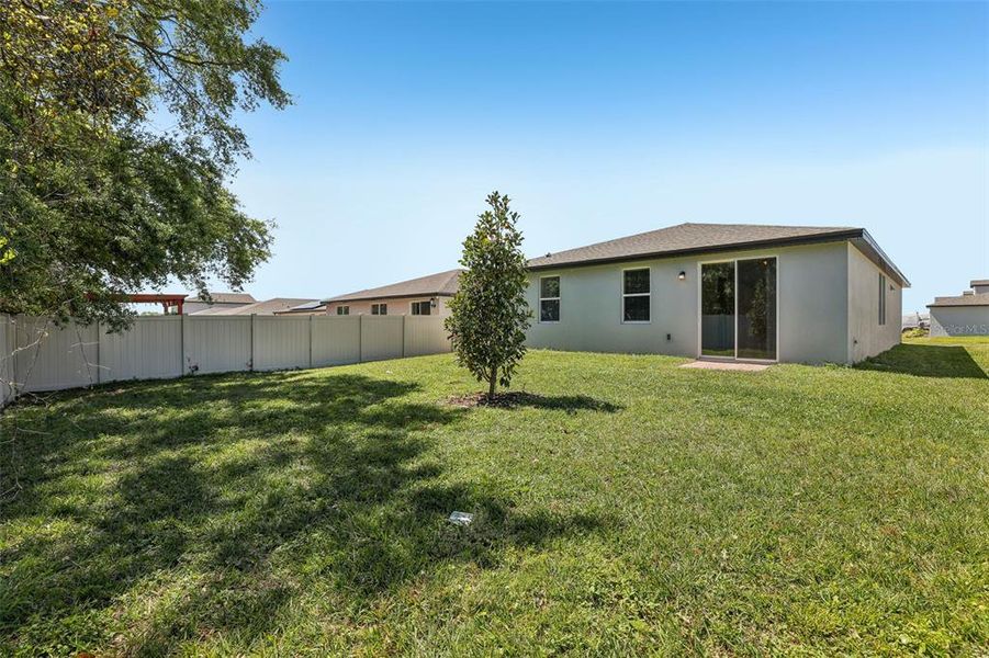 Exterior details and patio area of a home in Lawson Dunes - Signature Series, Haines City (Image 24).