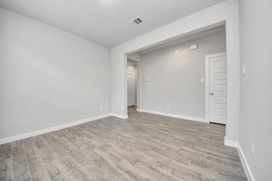 An inviting dining space seamlessly woven into the open concept, connecting thefamily room and kitchen.