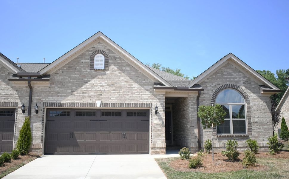 Front exterior of a new home in Northborough, Colfax, NC, highlighting curb appeal (Image 1). Front exterior of a new home in Northborough, Colfax, NC, highlighting curb appeal (Image 1).
