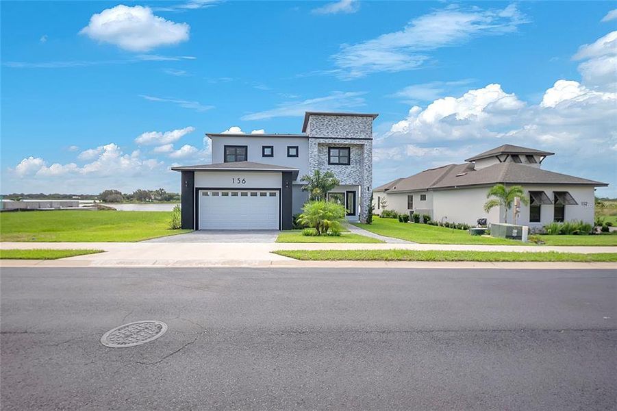 Front exterior of a new home in , Lake Alfred, FL, highlighting curb appeal (Image 23).