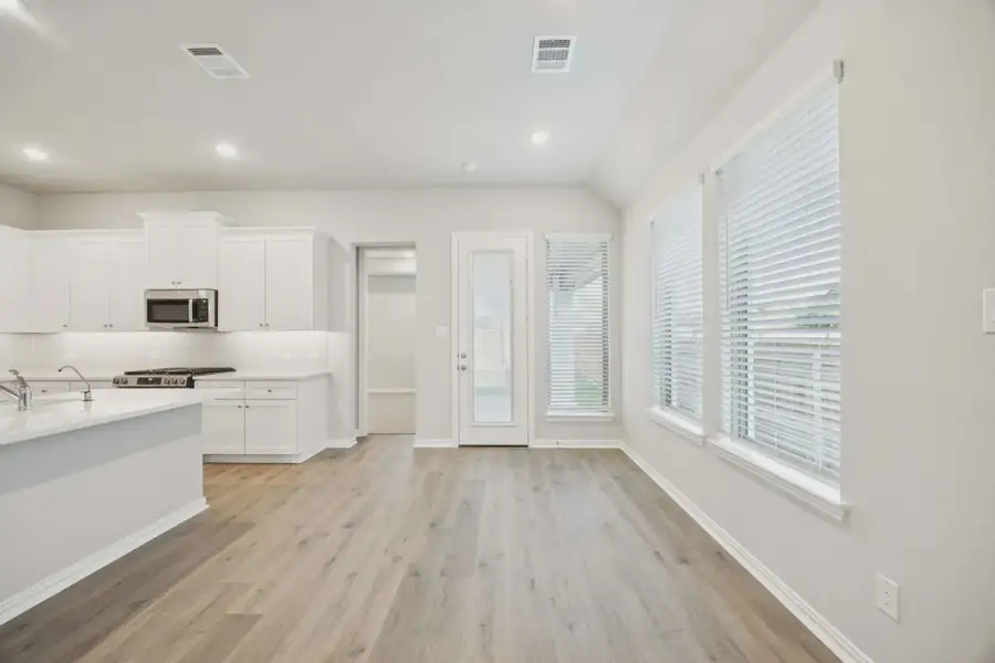 Representative unfurnished interior of a home built from the Sacramento by Chesmar Homes in Avondale, Fate (Image 4).