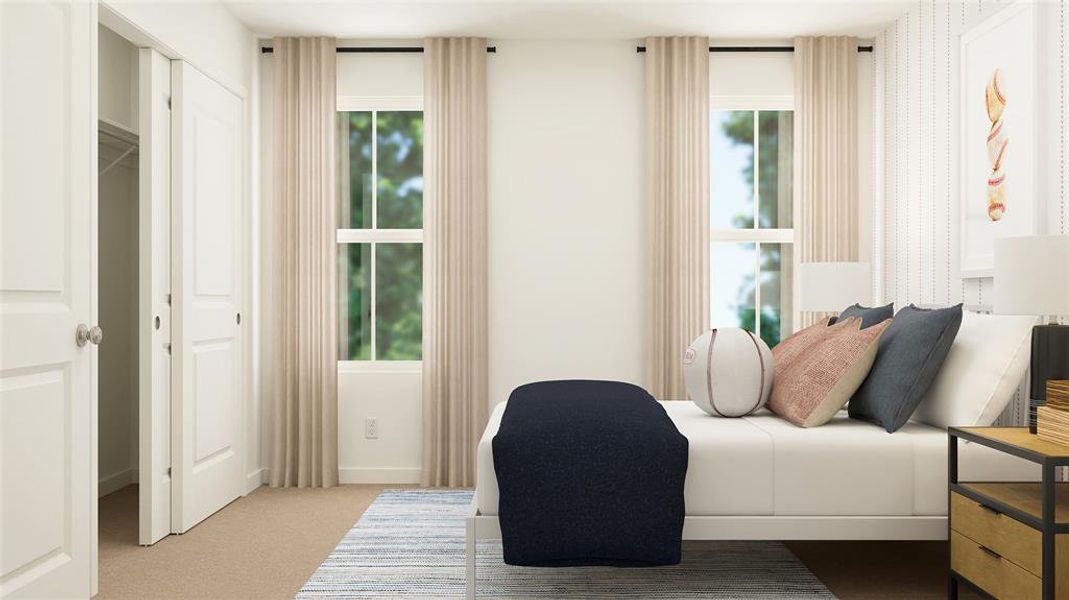 Carpeted bedroom featuring baseboards