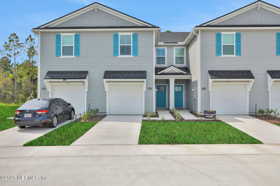 Front exterior of a new home in Atlantis Pointe, Middleburg, FL, highlighting curb appeal (Image 25).