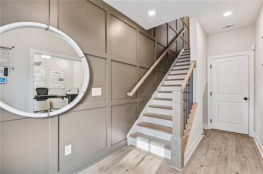 Hard wood stairs and treads- decorative trim design in staircase to second and third floors.