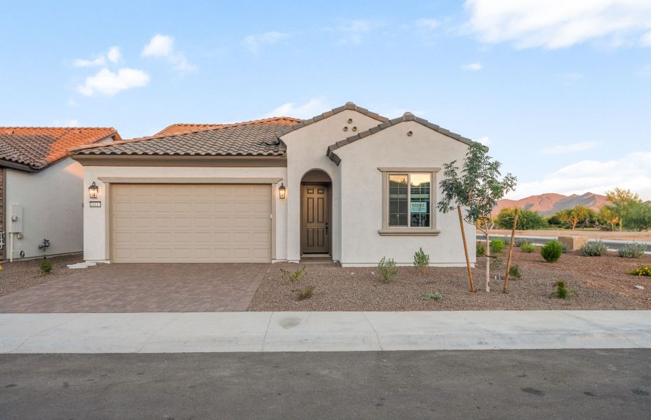 Front exterior of a new home in Sun City Festival, Buckeye, AZ, highlighting curb appeal (Image 24). Front exterior of a new home in Sun City Festival, Buckeye, AZ, highlighting curb appeal (Image 24).