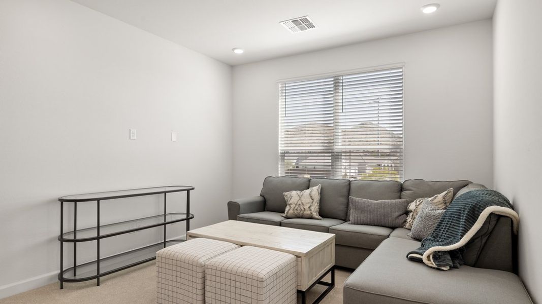 Representative furnished interior of a home built from the Crow by D.R. Horton in Apache Farms, Buckeye (Image 16).