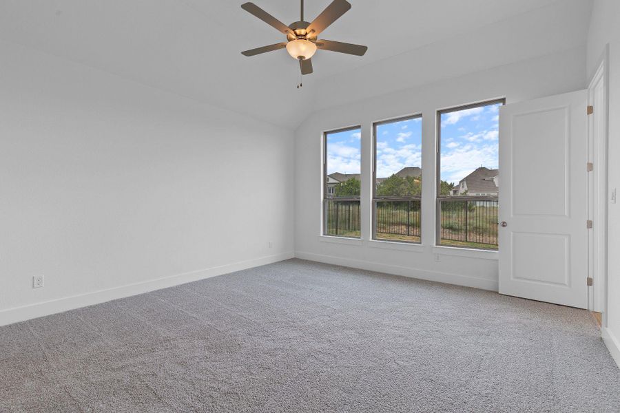 Primary Bedroom with elevated ceiling