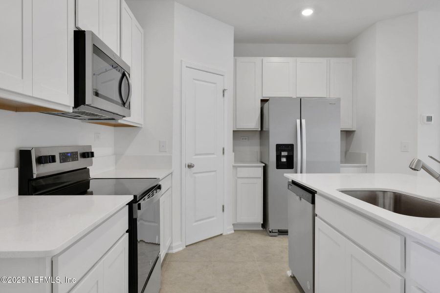Furnished interior view inside a new home in Atlantis Pointe, Middleburg (Image 7).