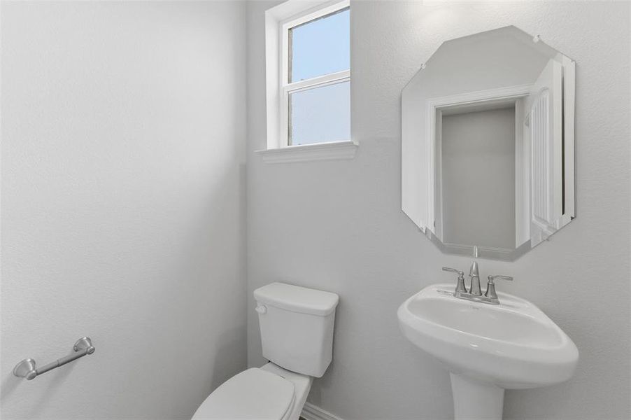 Bathroom featuring toilet and a sink