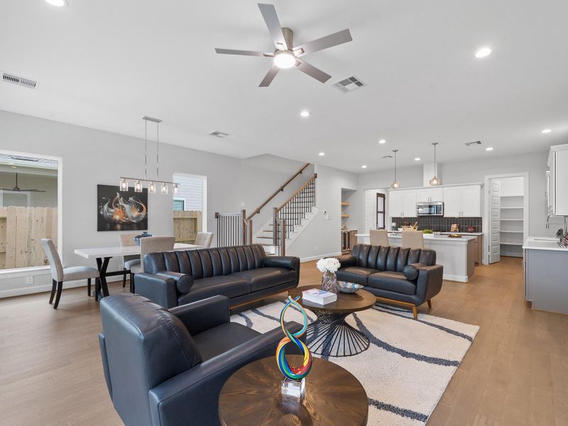 The inviting living room serves as the centerpiece of the home, offering an open and versatile space designed for relaxing evenings, lively gatherings, and everyday comfort. Image depicts home as-is.