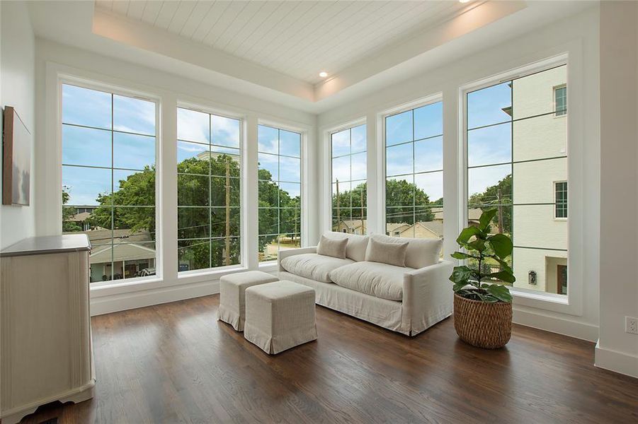 Sunroom with a tray ceiling