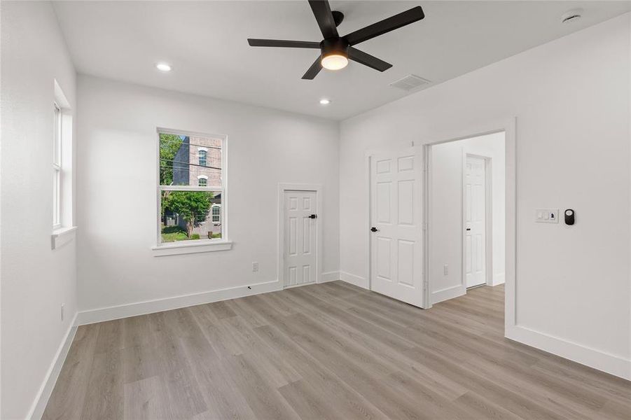Unfurnished room with light wood-style flooring, recessed lighting, and a ceiling fan