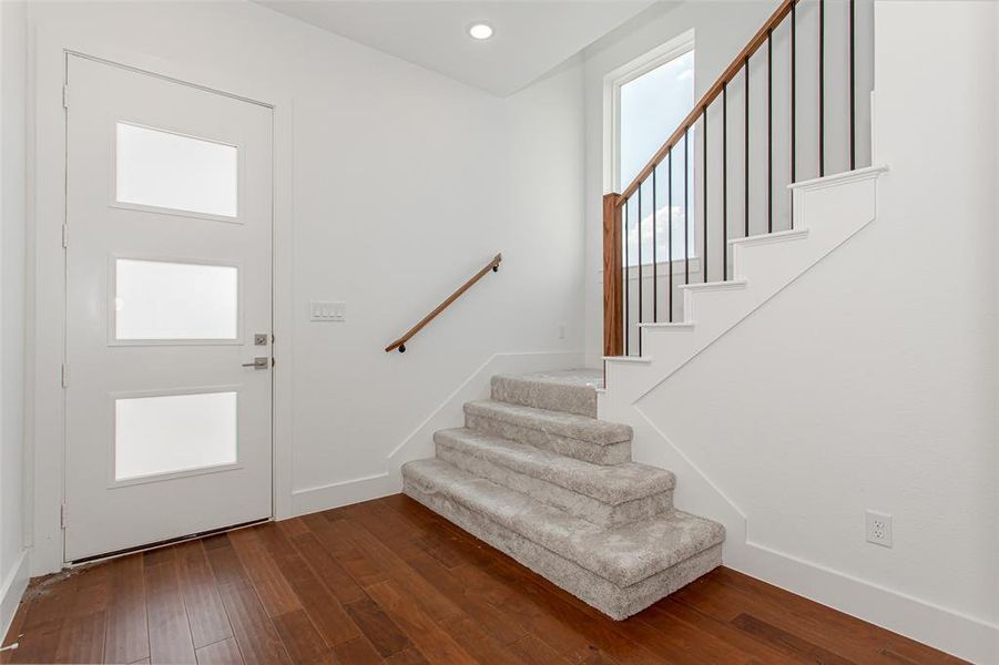 Entryway featuring a healthy amount of sunlight and wood-type flooring